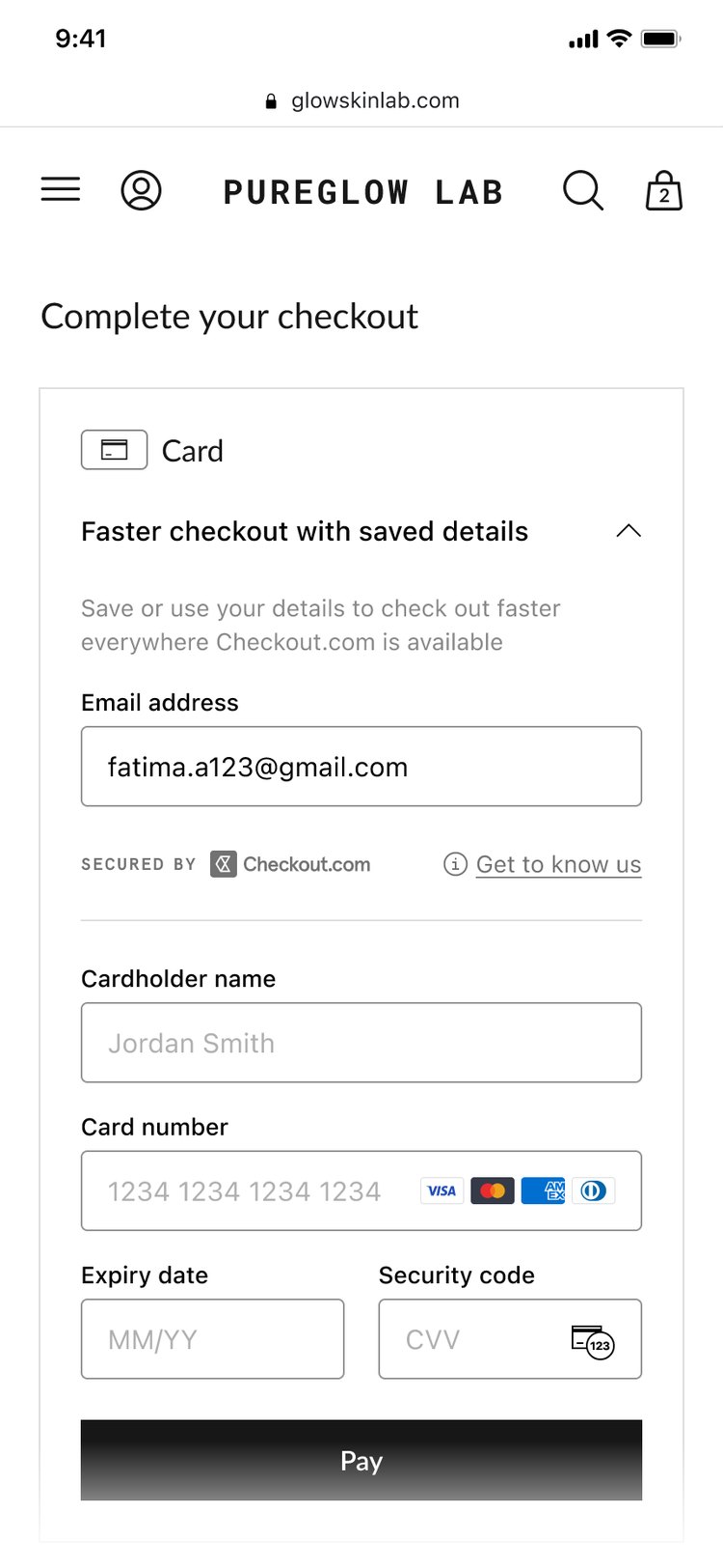 The checkout recognising a returning shopper by email address, marked 'Secured by Checkout.com'